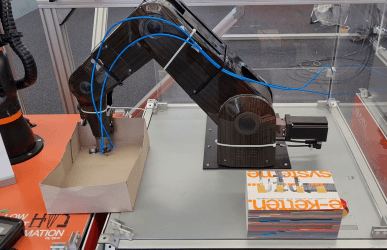 Robot places components in a box